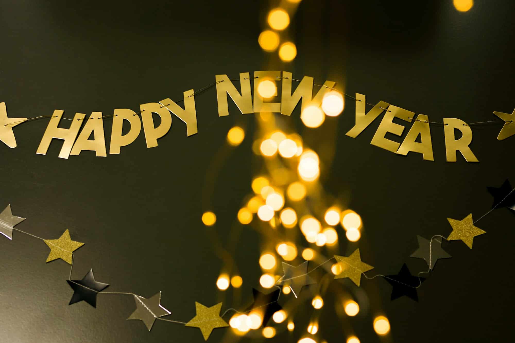 Golden Text Happy New Year On The Dark Background